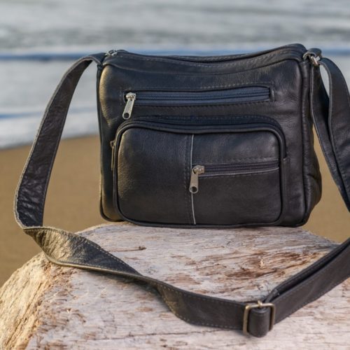 Sling bag with 6 zipped pockets