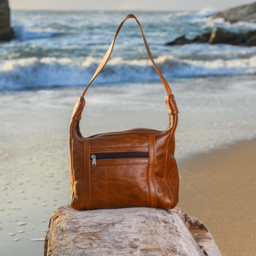 Genuine leather handbag with one handle.