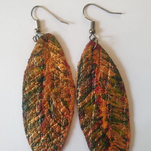 Painted green and gold leather earrings.