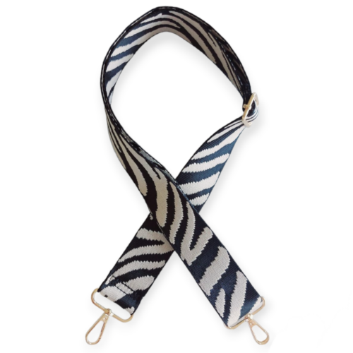 Bag strap with black and cream zebra type pattern