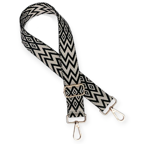 Bag strap with black and white zig zag pattern